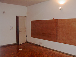 Plywood constructed on the left wall